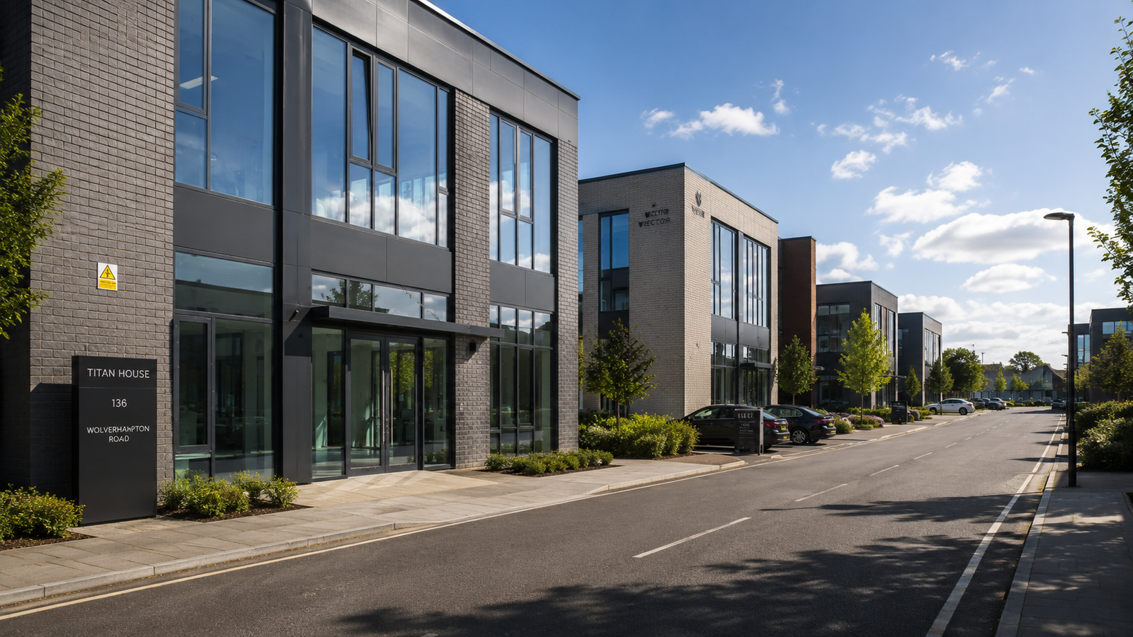 Commercial office building fitted with slimline anthracite grey aluminium windows and doors