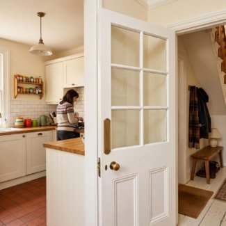 Half-glazed white internal door glass between kitchen and hallway